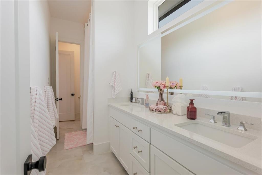 7381 Mesquite Ridge Sanger, TX 76266 - Photo 28 of 40 a bathroom with a sink and a mirror