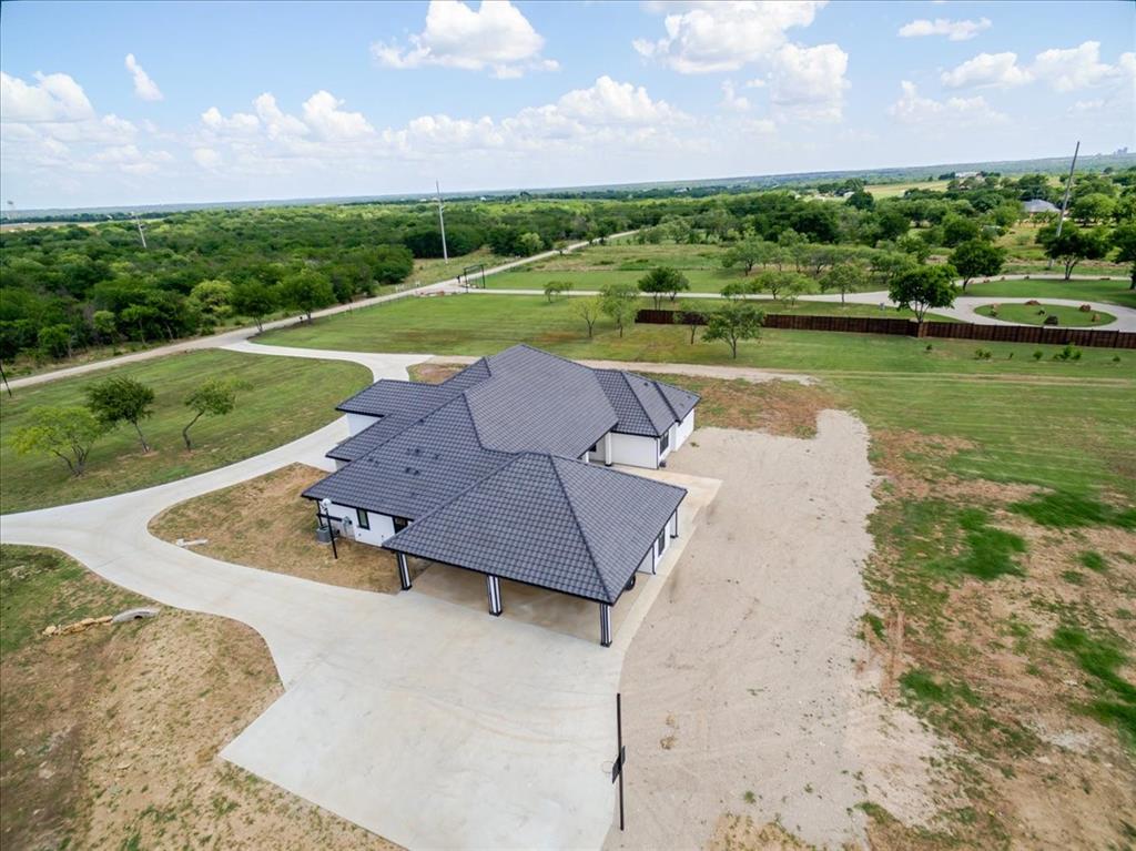 7381 Mesquite Ridge Sanger, TX 76266 - Photo 30 of 40 a view of a lake with a yard