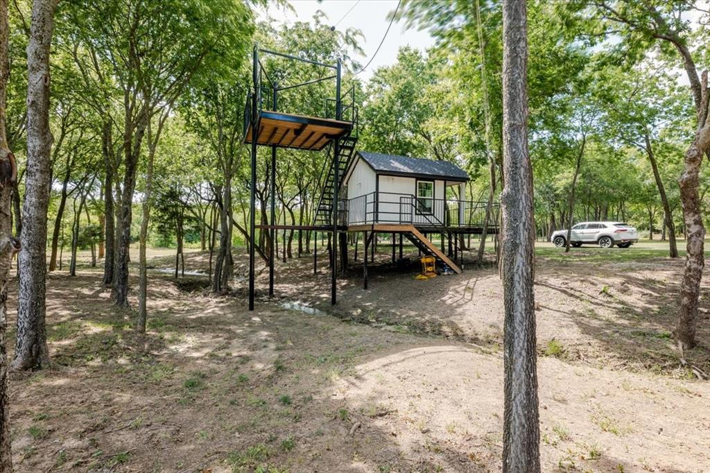 7381 Mesquite Ridge Sanger, TX 76266 - Photo 34 of 40 a view of a outdoor space with a car parked