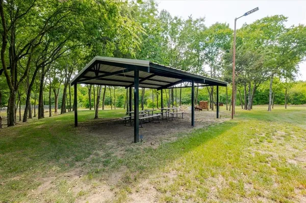 a porch with a table and chairs