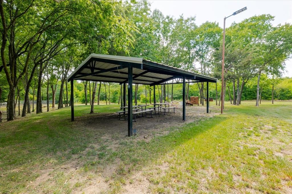 7381 Mesquite Ridge Sanger, TX 76266 - Photo 36 of 40 a view of a yard with a slide and large trees