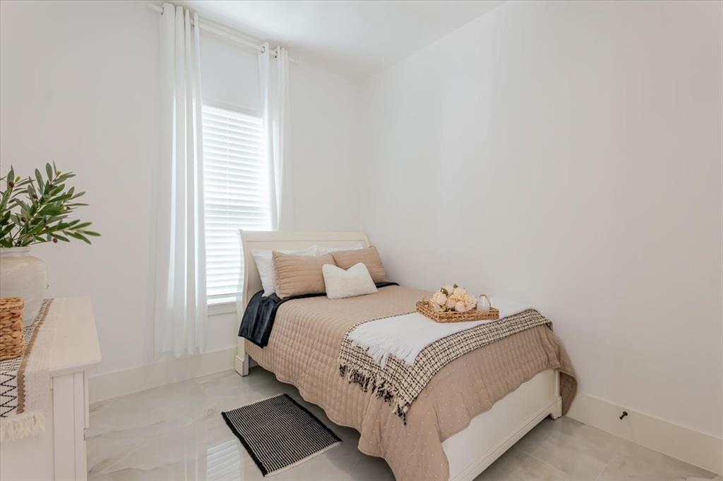 7381 Mesquite Ridge Sanger, TX 76266 - Photo 38 of 40 a bedroom with a bed and a window