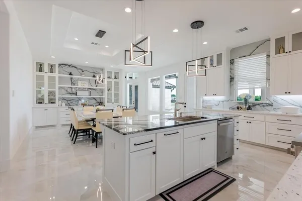 a kitchen with counter space cabinets and appliances