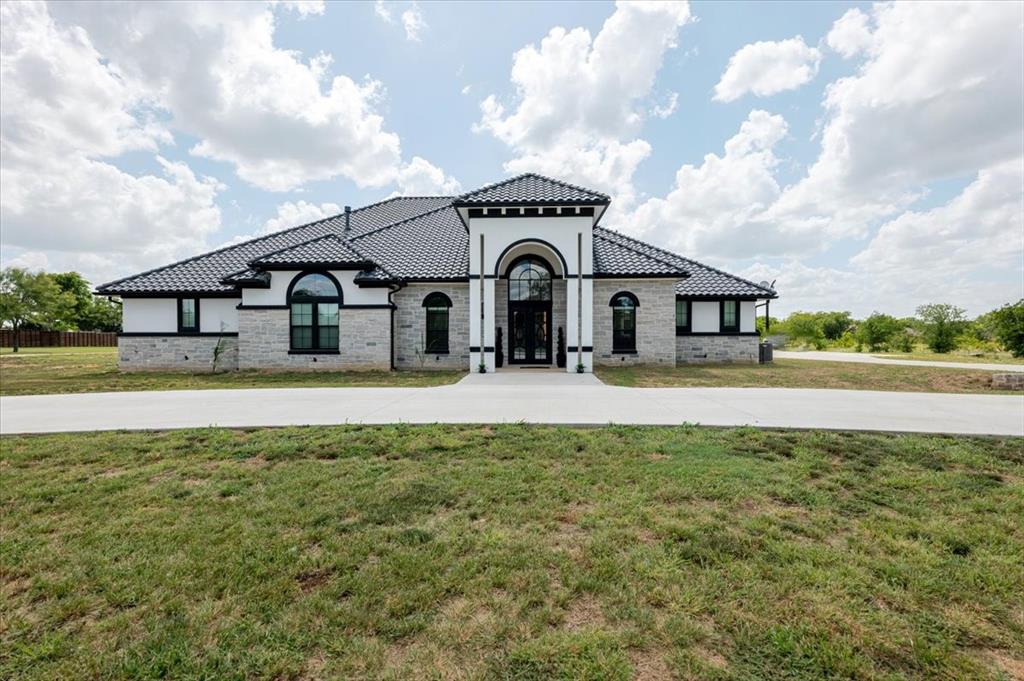 7381 Mesquite Ridge Sanger, TX 76266 - Photo 7 of 40 a front view of a house with a yard