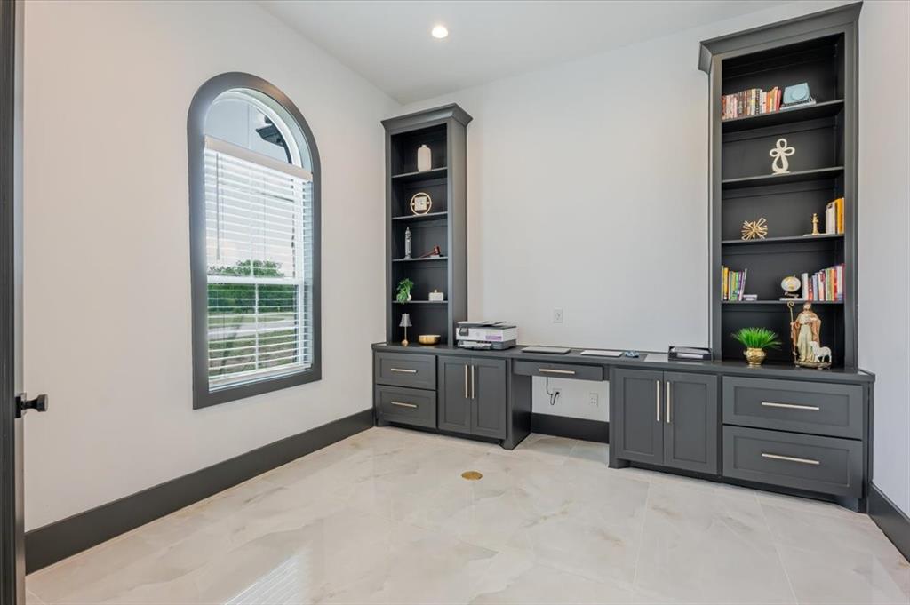 7381 Mesquite Ridge Sanger, TX 76266 - Photo 9 of 40 a room with a large window and cabinet