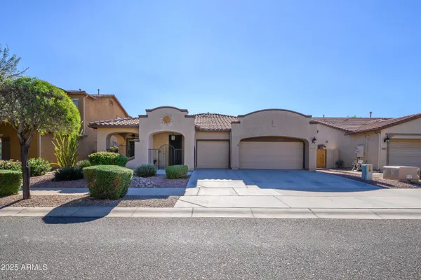 a front view of house with yard outdoor seating and yard in back