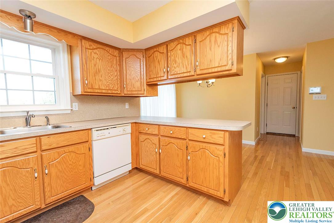 520 5 Points Richmond Road Bangor, PA 18013 - Photo 18 of 48 a kitchen with stainless steel appliances granite countertop a sink and cabinets with wooden floor