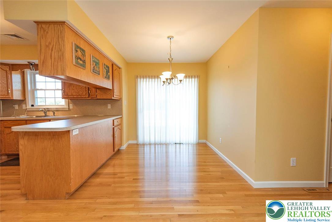 520 5 Points Richmond Road Bangor, PA 18013 - Photo 20 of 48 a hallway with a dining table chairs and chandelier
