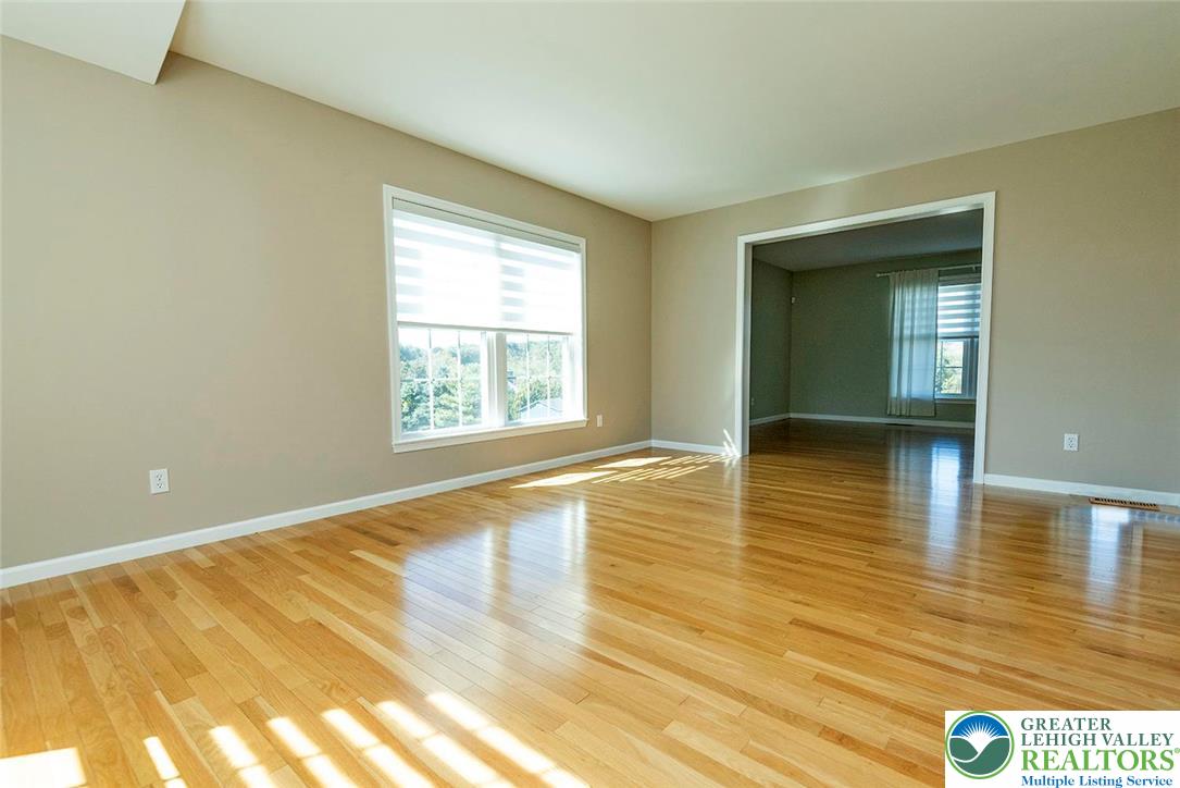 520 5 Points Richmond Road Bangor, PA 18013 - Photo 7 of 48 an empty room with wooden floor and windows