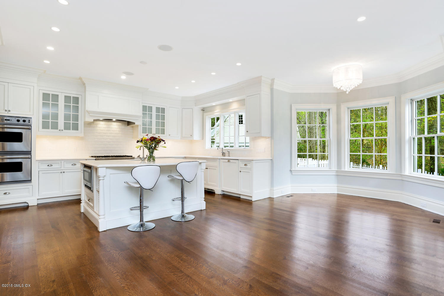 17 Dialstone Lane Riverside, CT 06878 - Photo 11 of 50 a living room with stainless steel appliances kitchen island hardwood floor and a large window
