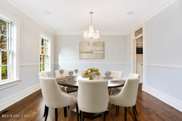 17 Dialstone Lane Riverside, CT 06878 - Photo 15 of 50 a dining room with furniture a window and a chandelier