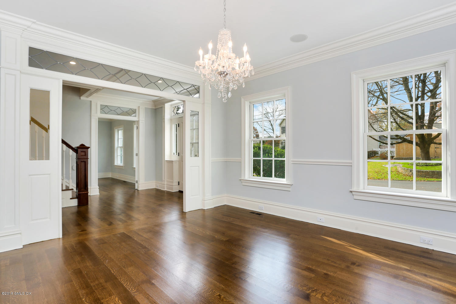17 Dialstone Lane Riverside, CT 06878 - Photo 16 of 50 a view of an empty room with wooden floor and a window