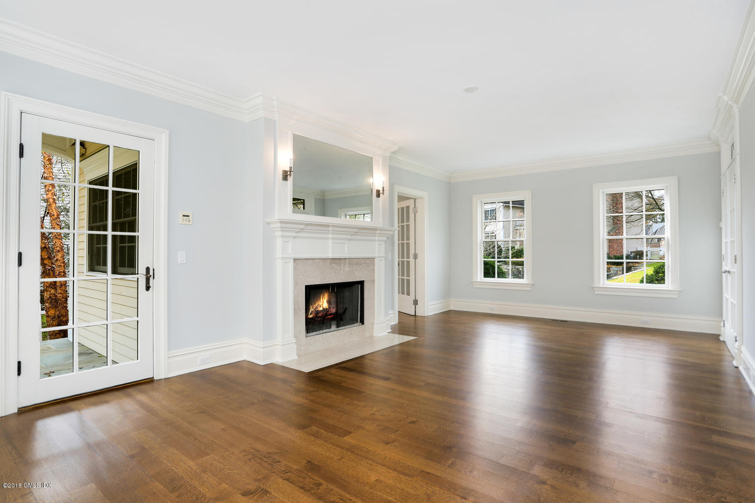 17 Dialstone Lane Riverside, CT 06878 - Photo 17 of 50 a view of an empty room with window and fire place