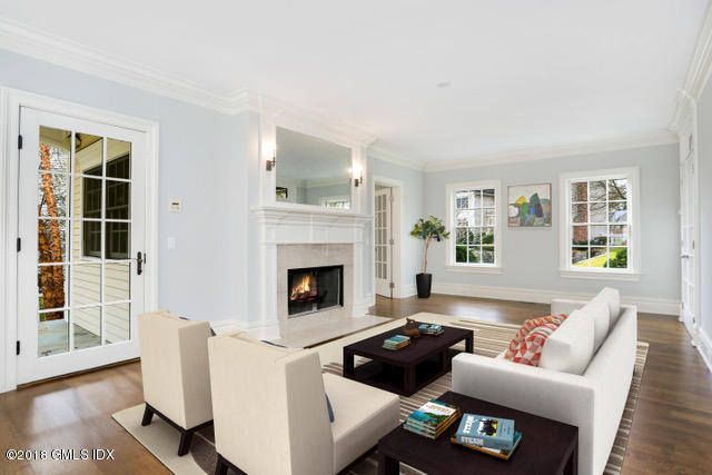 17 Dialstone Lane Riverside, CT 06878 - Photo 18 of 50 a living room with furniture and a fireplace