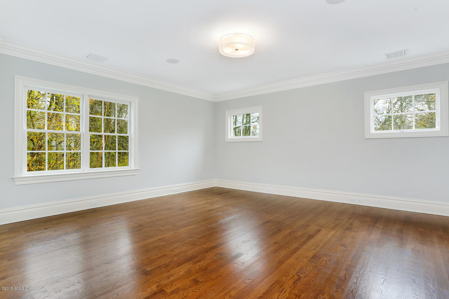 17 Dialstone Lane Riverside, CT 06878 - Photo 19 of 50 a view of an empty room with wooden floor and a window