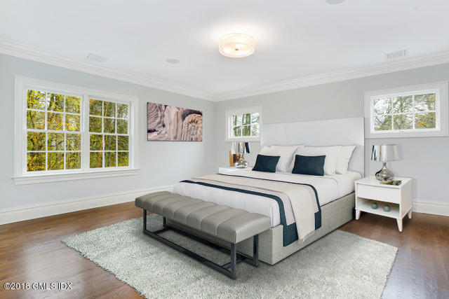 17 Dialstone Lane Riverside, CT 06878 - Photo 20 of 50 a spacious bedroom with a bed and a large window