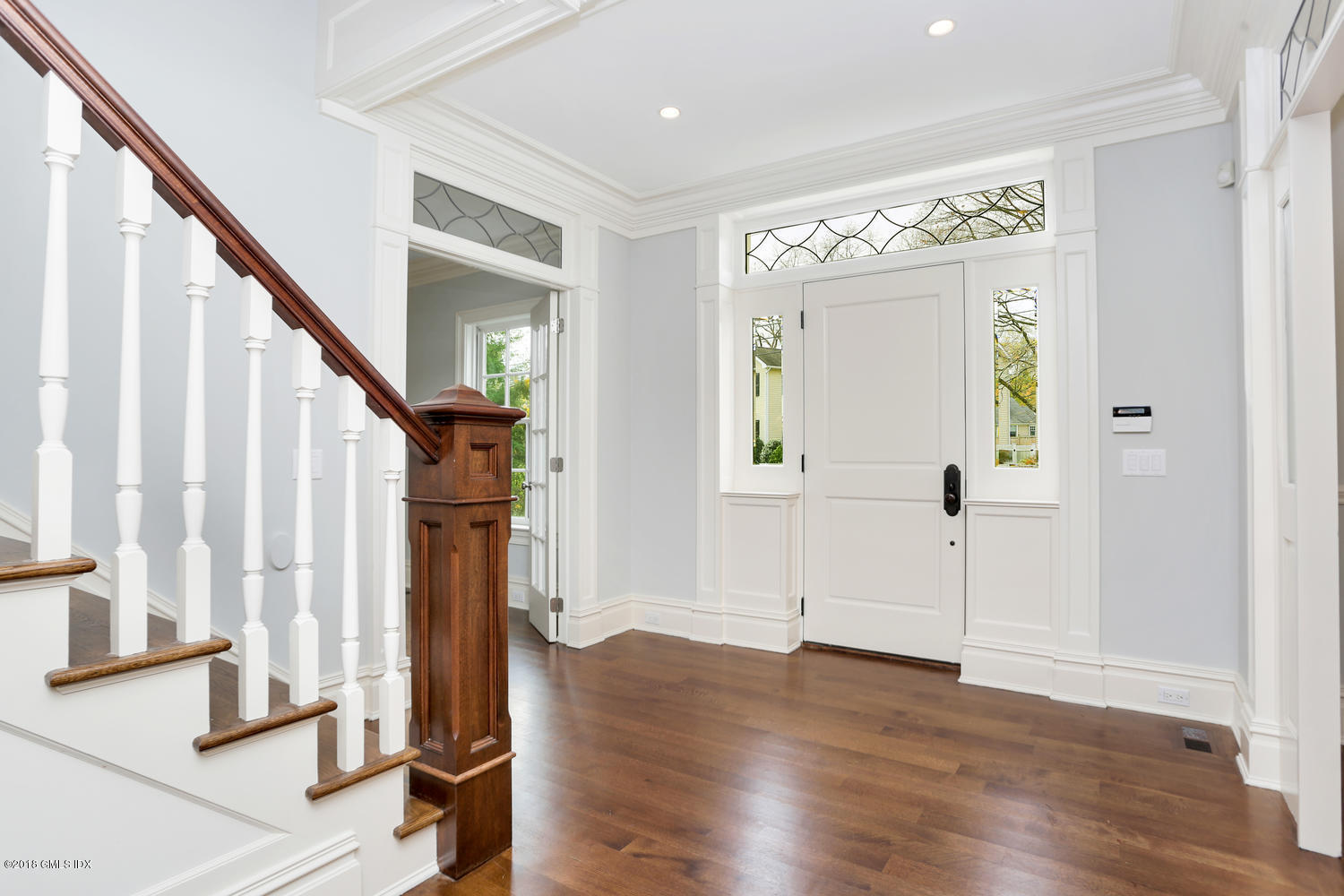 17 Dialstone Lane Riverside, CT 06878 - Photo 2 of 50 a view of an entryway with wooden floor and stairs