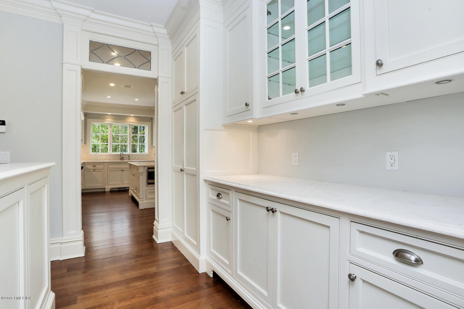 17 Dialstone Lane Riverside, CT 06878 - Photo 23 of 50 a kitchen with a white cabinets and wooden floor