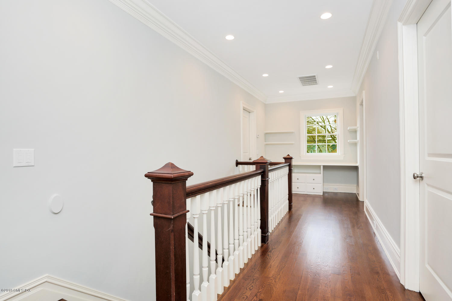 17 Dialstone Lane Riverside, CT 06878 - Photo 31 of 50 a view of a hallway with wooden floor and staircase