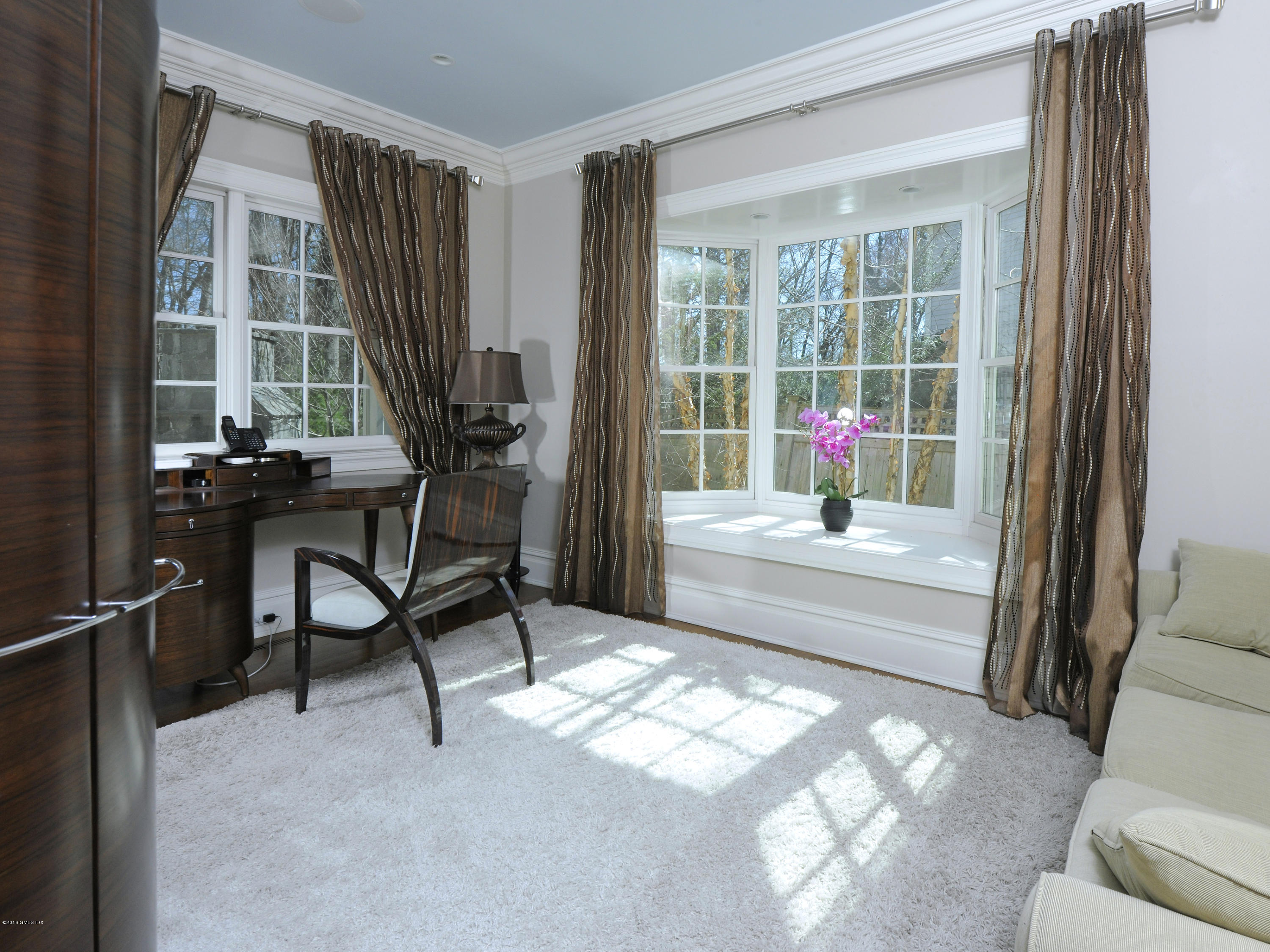 17 Dialstone Lane Riverside, CT 06878 - Photo 35 of 50 a living room with furniture and a window