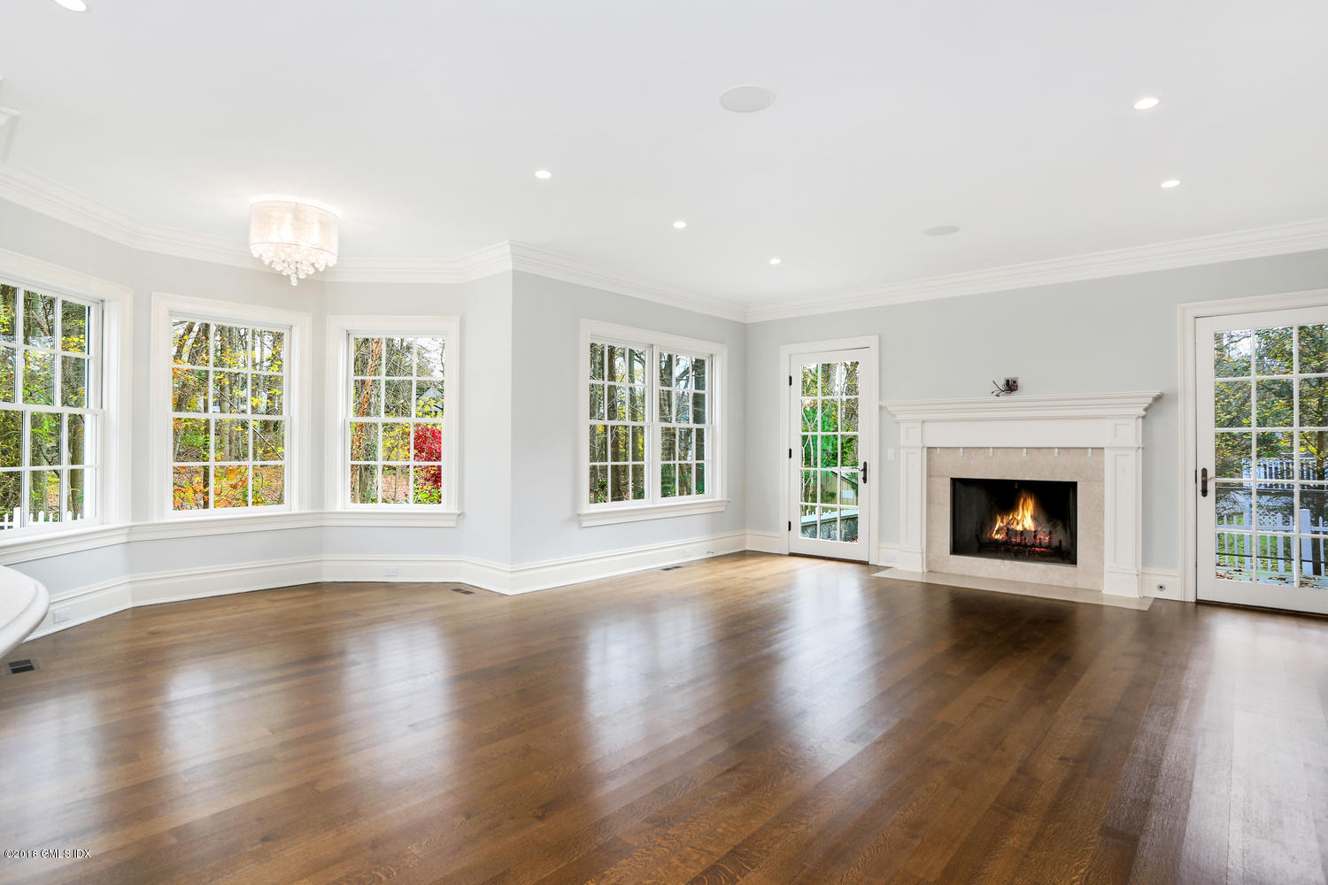 17 Dialstone Lane Riverside, CT 06878 - Photo 6 of 50 a view of an empty room with wooden floor and a window