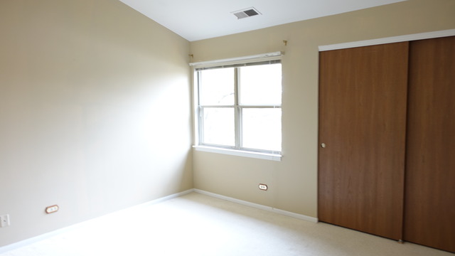 913 Ridgefield Lane Wheeling, IL 60090 - Photo 11 of 23 a view of an empty room with a window