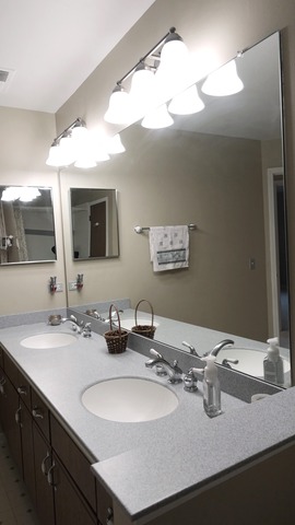 913 Ridgefield Lane Wheeling, IL 60090 - Photo 17 of 23 a bathroom with a sink double vanity and a mirror