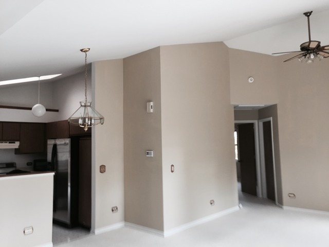 913 Ridgefield Lane Wheeling, IL 60090 - Photo 9 of 23 a view of hallway with stairs and wooden floor