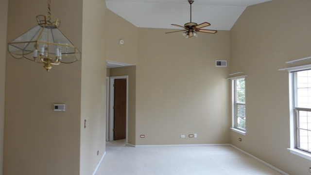 913 Ridgefield Lane Wheeling, IL 60090 - Photo 10 of 23 a view of a room with a window and a ceiling fan