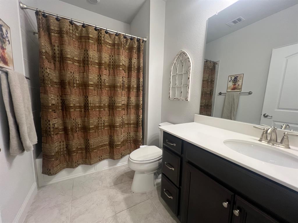 651 Watters Road, Unit 7101 Allen, TX 75013 - Photo 14 of 25 a bathroom with a sink toilet and shower