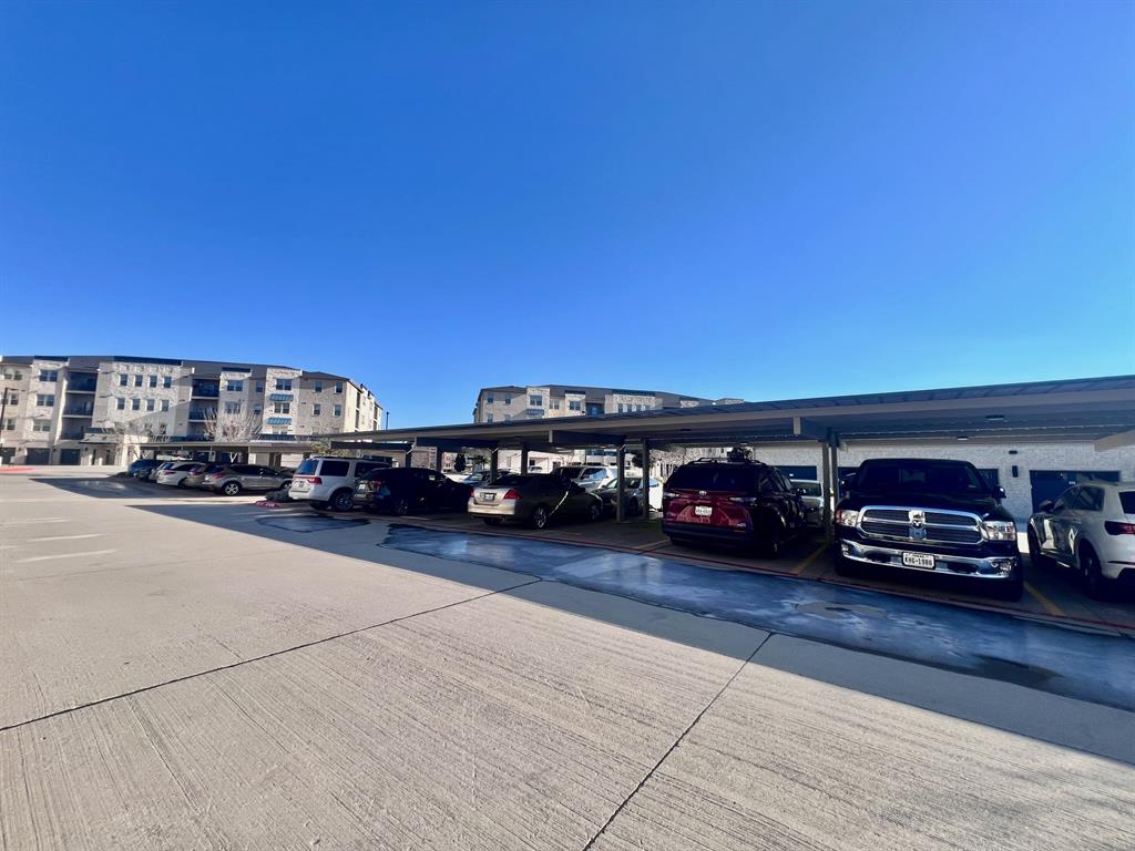 651 Watters Road, Unit 7101 Allen, TX 75013 - Photo 18 of 25 a view of a parking area