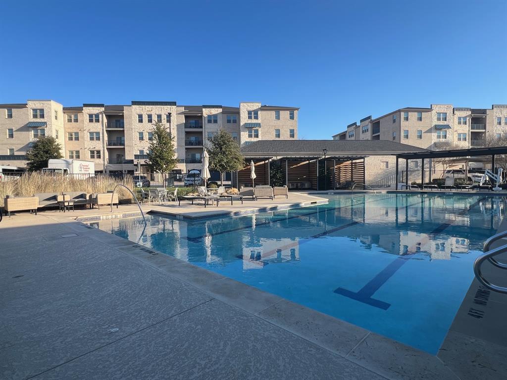 651 Watters Road, Unit 7101 Allen, TX 75013 - Photo 19 of 25 a large building with a table and chairs