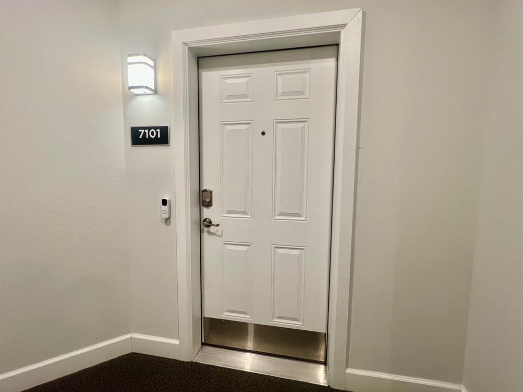 651 Watters Road, Unit 7101 Allen, TX 75013 - Photo 4 of 25 a view of a hallway with wooden floor