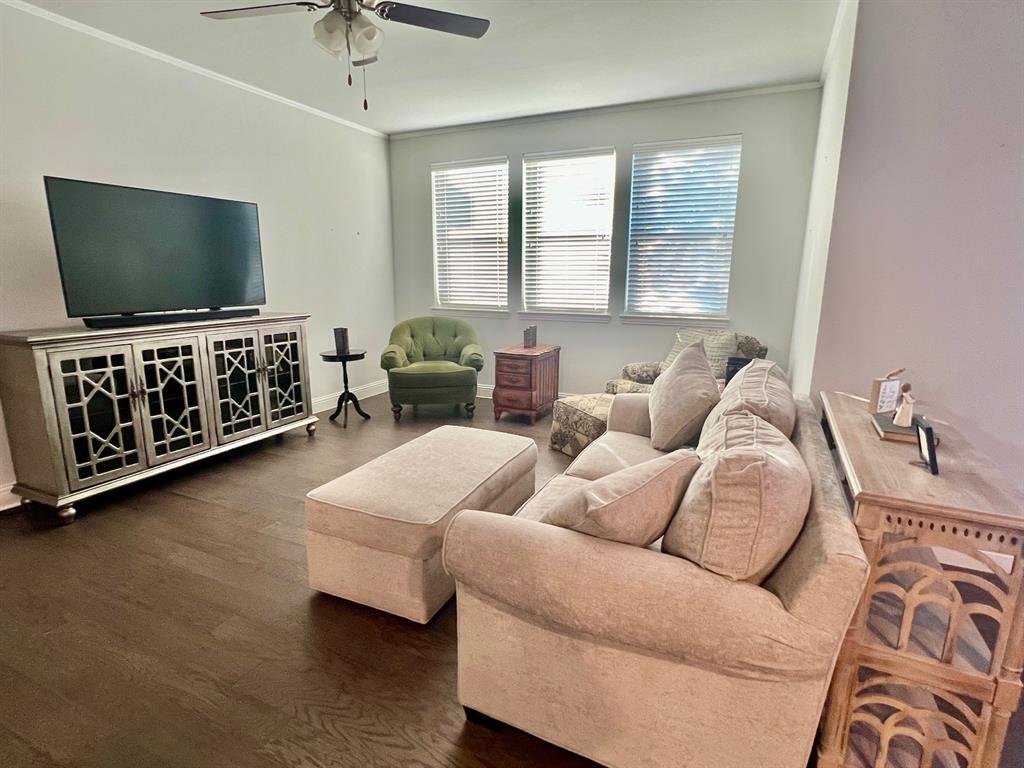 651 Watters Road, Unit 7101 Allen, TX 75013 - Photo 6 of 25 a living room with furniture and a flat screen tv