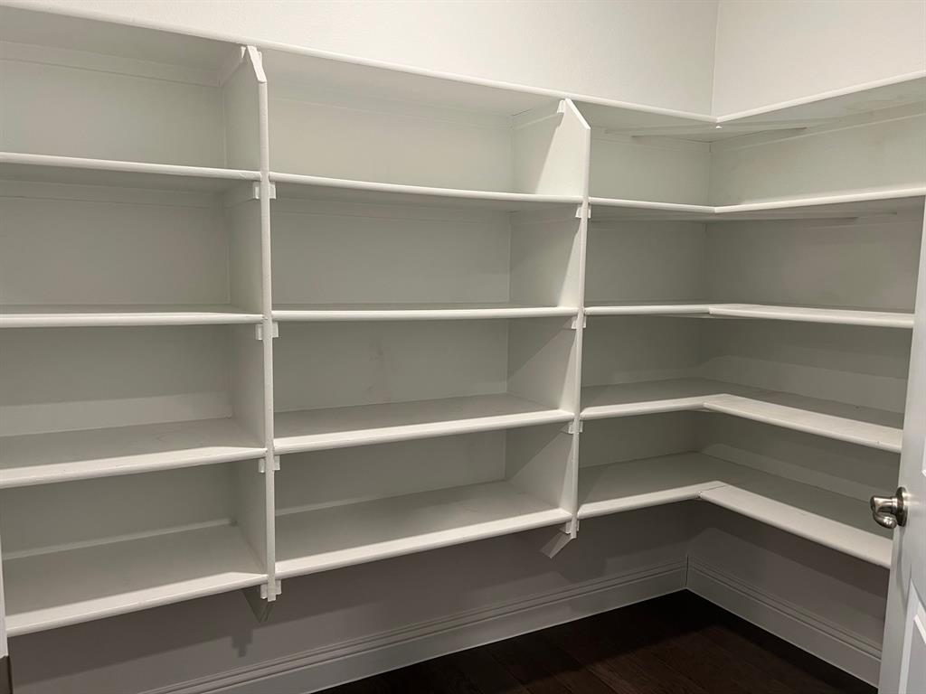 651 Watters Road, Unit 7101 Allen, TX 75013 - Photo 9 of 25 a view of walk in closet with empty racks