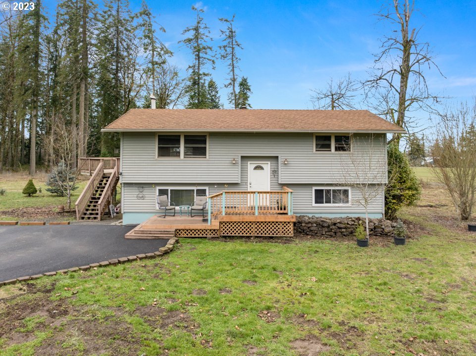 8880 Southwest River Road Hillsboro, OR 97123 - Photo 1 of 25 a front view of a house with a yard