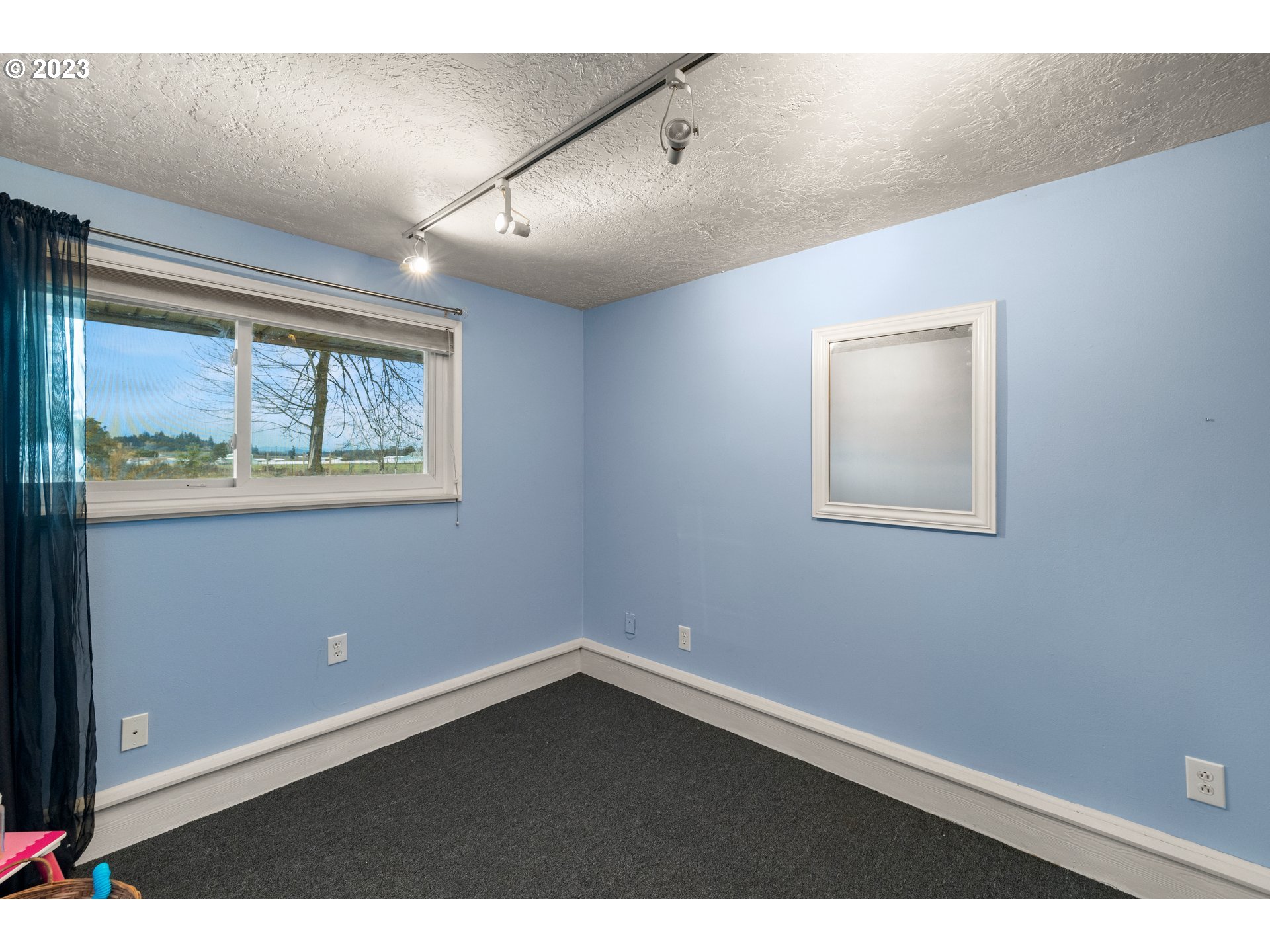 8880 Southwest River Road Hillsboro, OR 97123 - Photo 13 of 25 a view of an empty room with a window