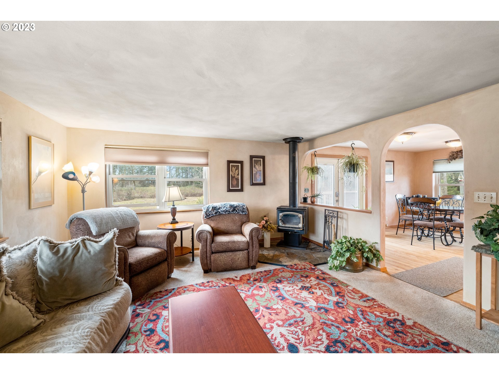 8880 Southwest River Road Hillsboro, OR 97123 - Photo 4 of 25 a living room with furniture and a large window
