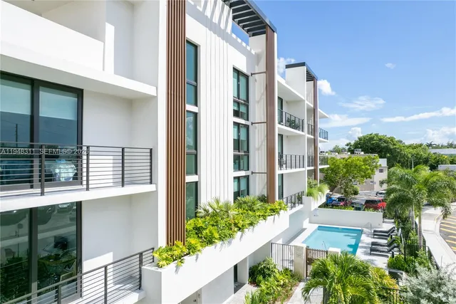 a view of a building with a garden