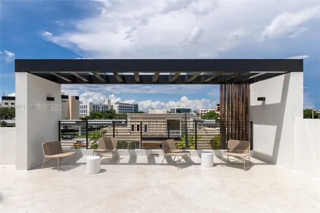 a view of swimming pool with furniture
