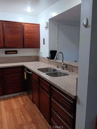 a kitchen with a sink and cabinets