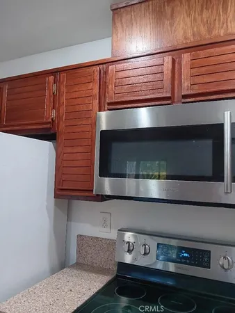 a kitchen with a stove and a microwave
