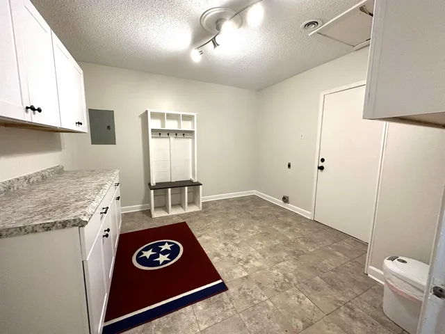 a kitchen with a stove a refrigerator and a stove