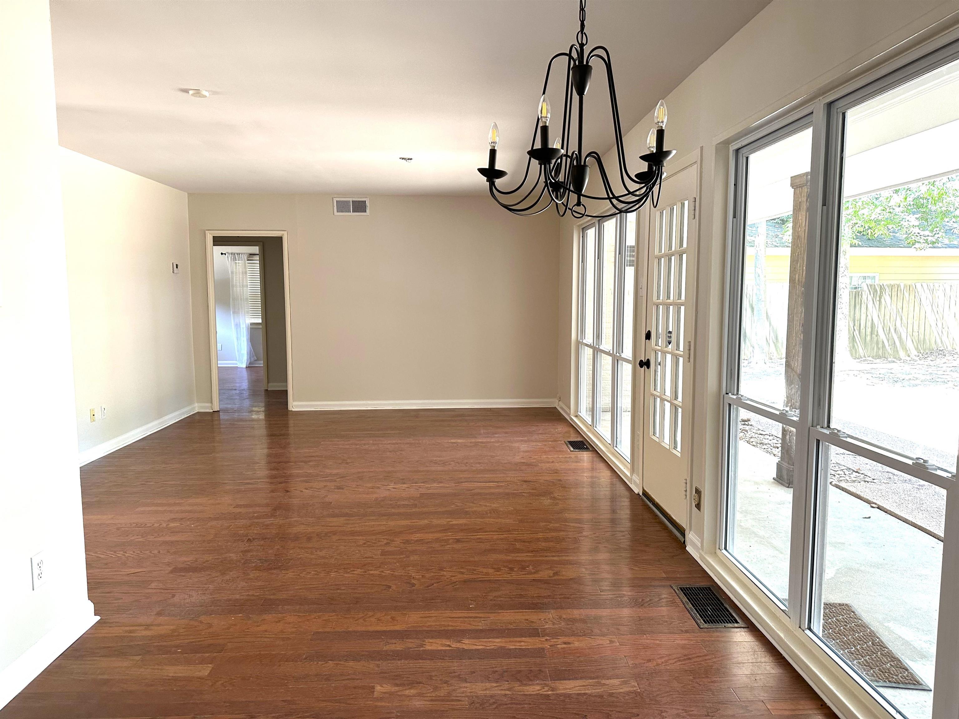 5260 Brantford Avenue Memphis, TN 38120 - Photo 15 of 23 a view of empty room with wooden floor and fan