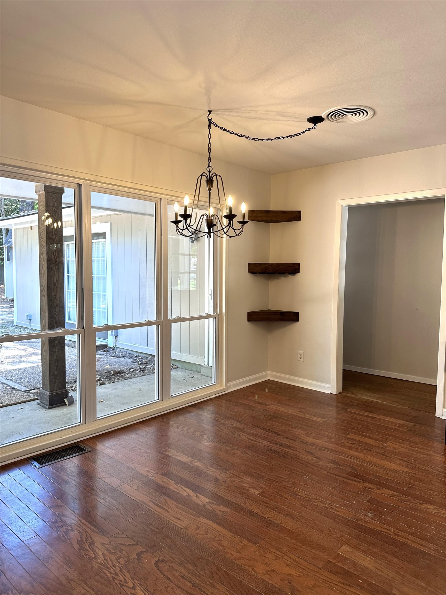 5260 Brantford Avenue Memphis, TN 38120 - Photo 17 of 23 an empty room with wooden floor and windows