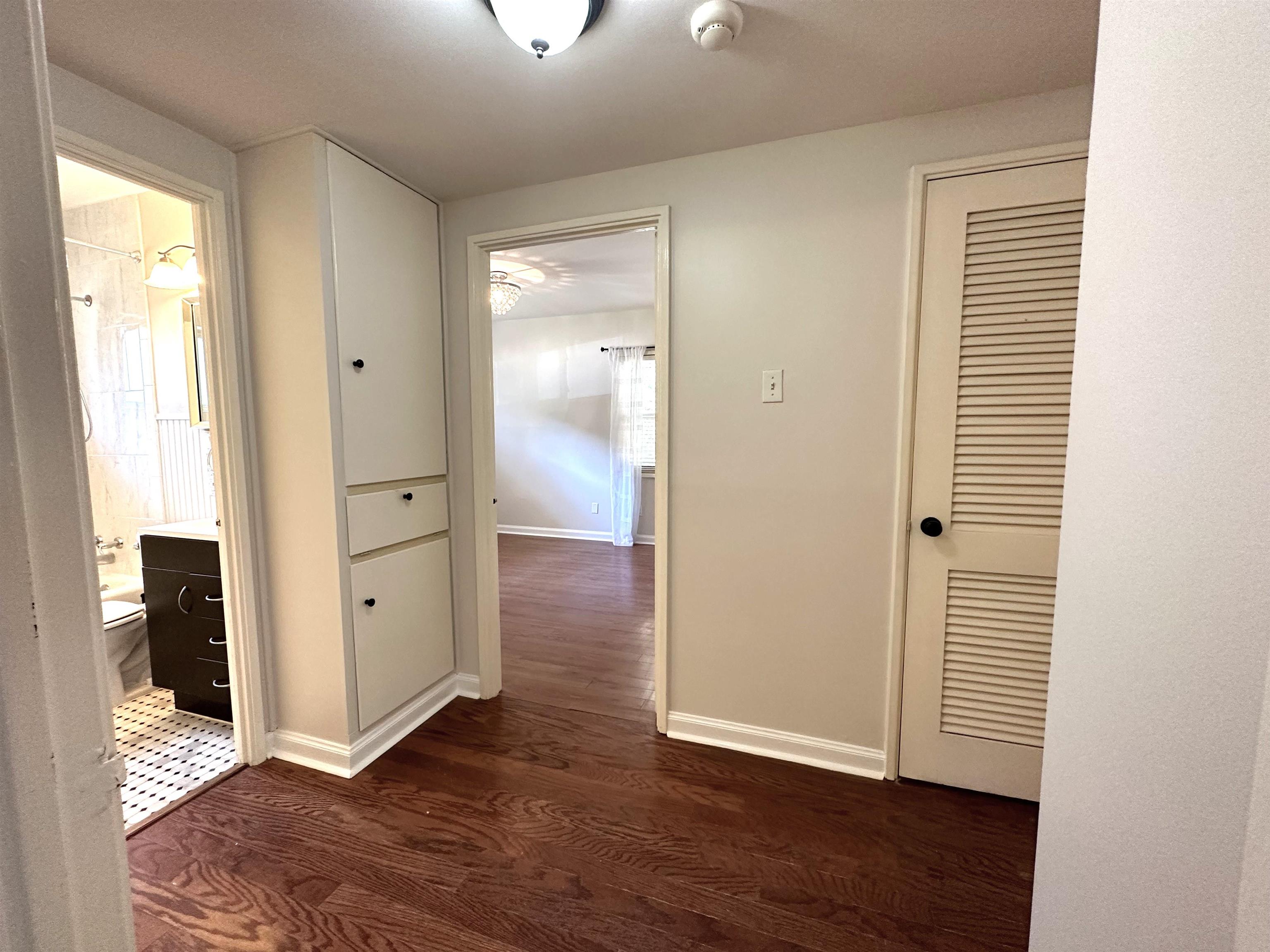 5260 Brantford Avenue Memphis, TN 38120 - Photo 19 of 23 an empty room with wooden floor closet and windows