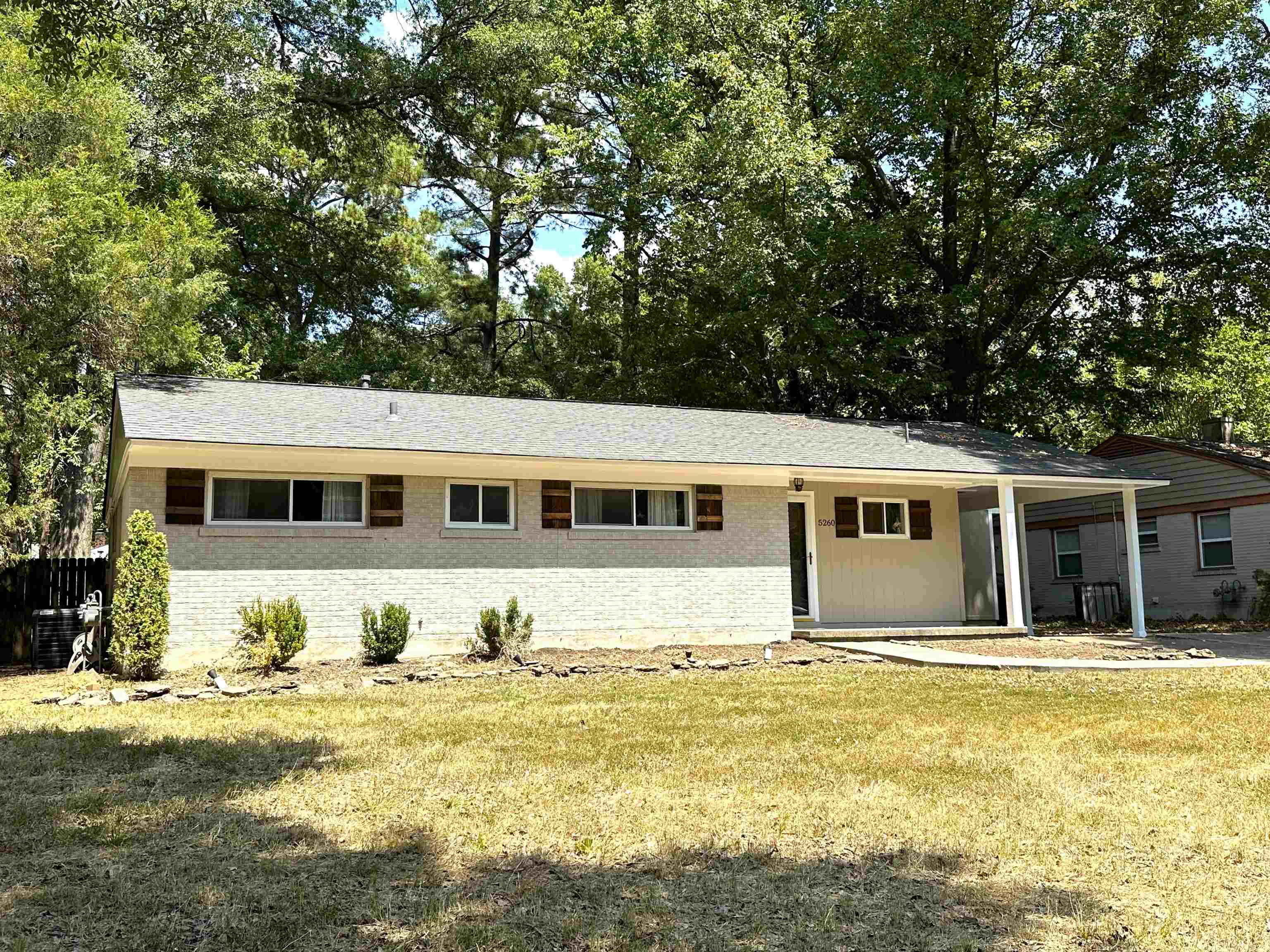 5260 Brantford Avenue Memphis, TN 38120 - Photo 2 of 23 a front view of a house with a swimming pool