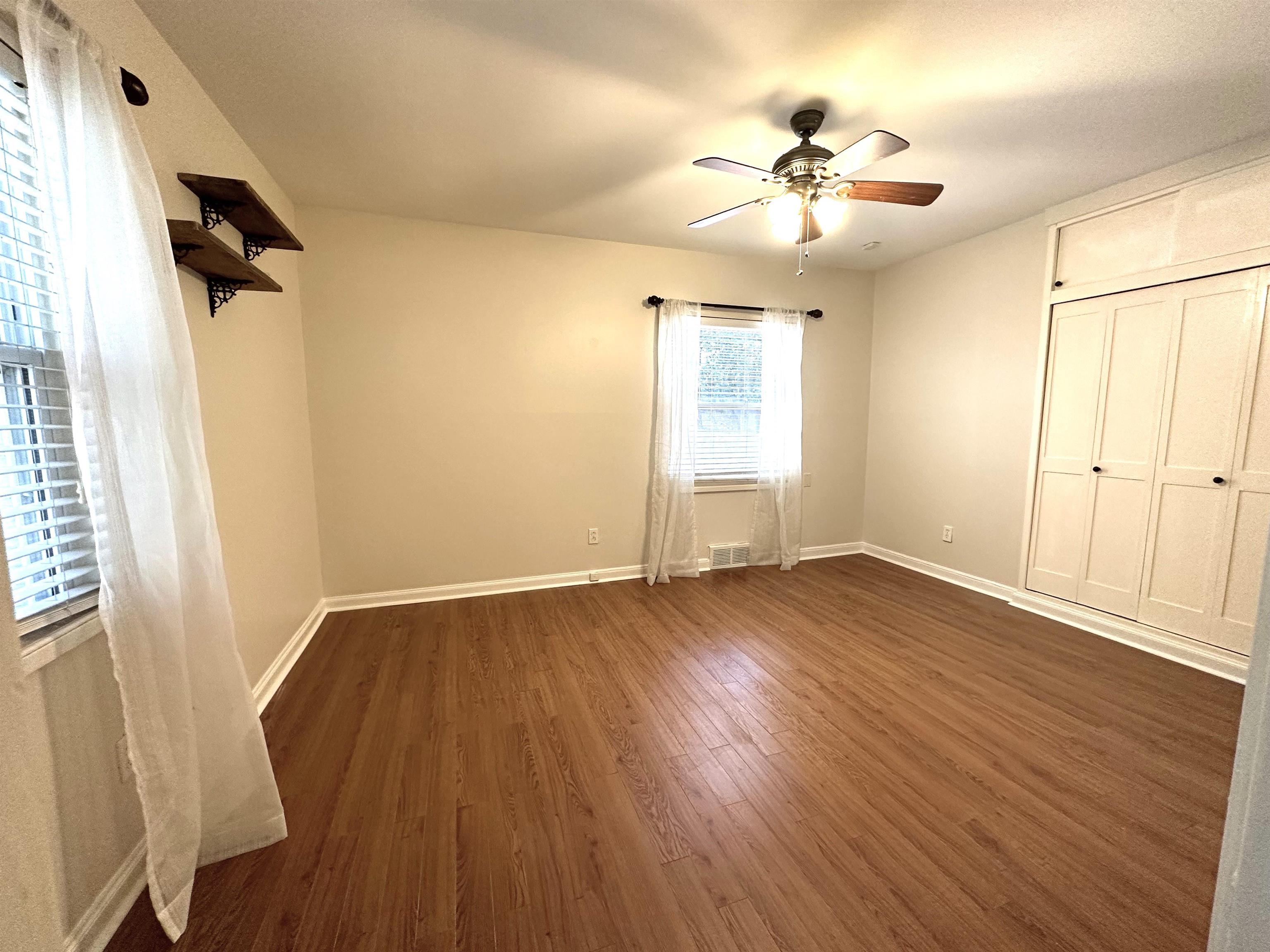 5260 Brantford Avenue Memphis, TN 38120 - Photo 22 of 23 an empty room with wooden floor and windows