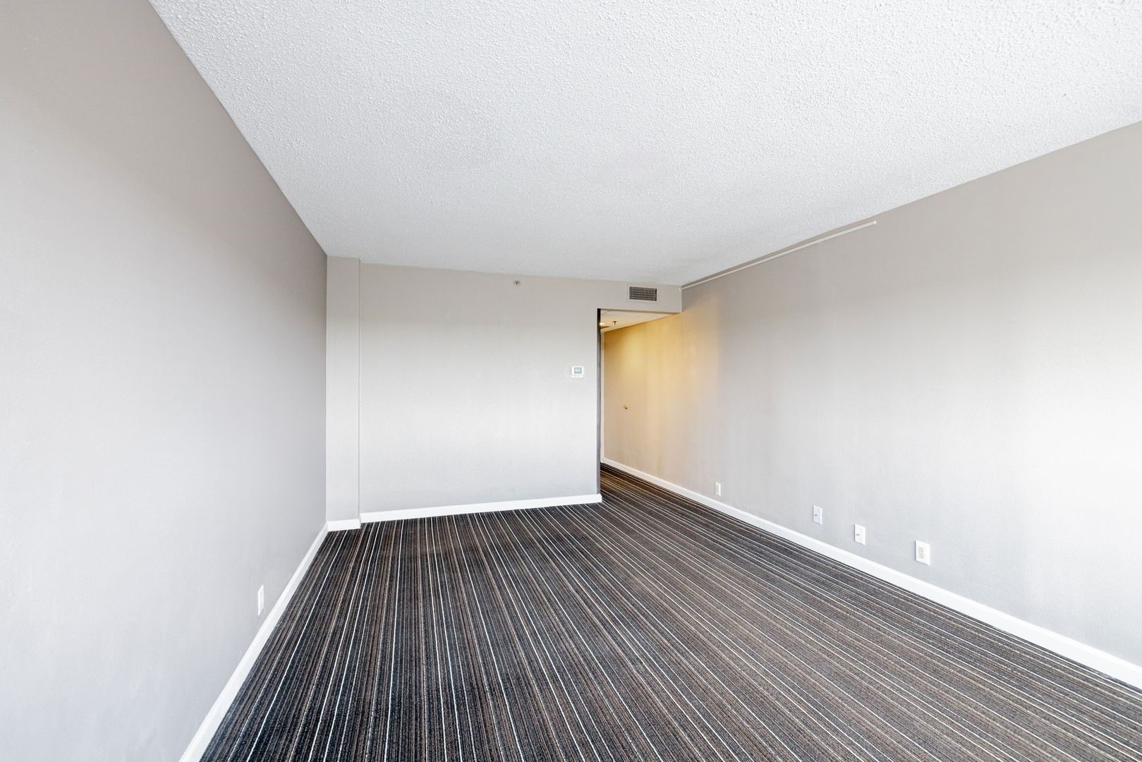 14703 Park Row Houston, TX 77079 - Photo 39 of 40 a view of an empty room with wooden floor