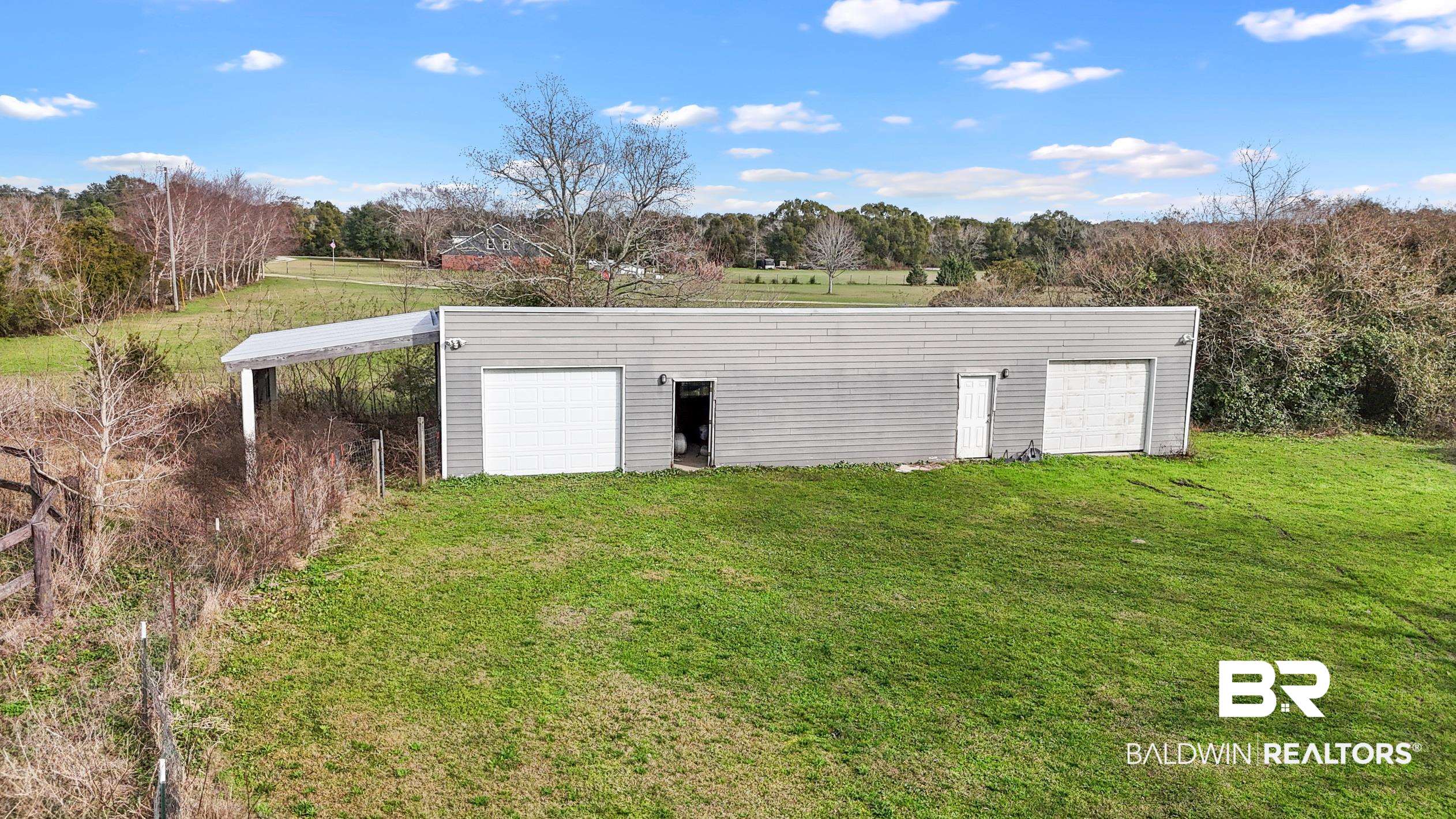 13358 County Road 91 Elberta, AL 36530 - Photo 41 of 47 View of outdoor structure featuring a yard, a garage, and a carport